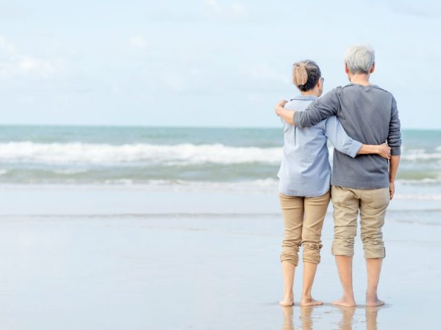asian-couple-senior-walking-beach-holding-hands-honeymoon-family-together-happiness-lifestyle-life-after-retirement-plan-life-insurance-compressed
